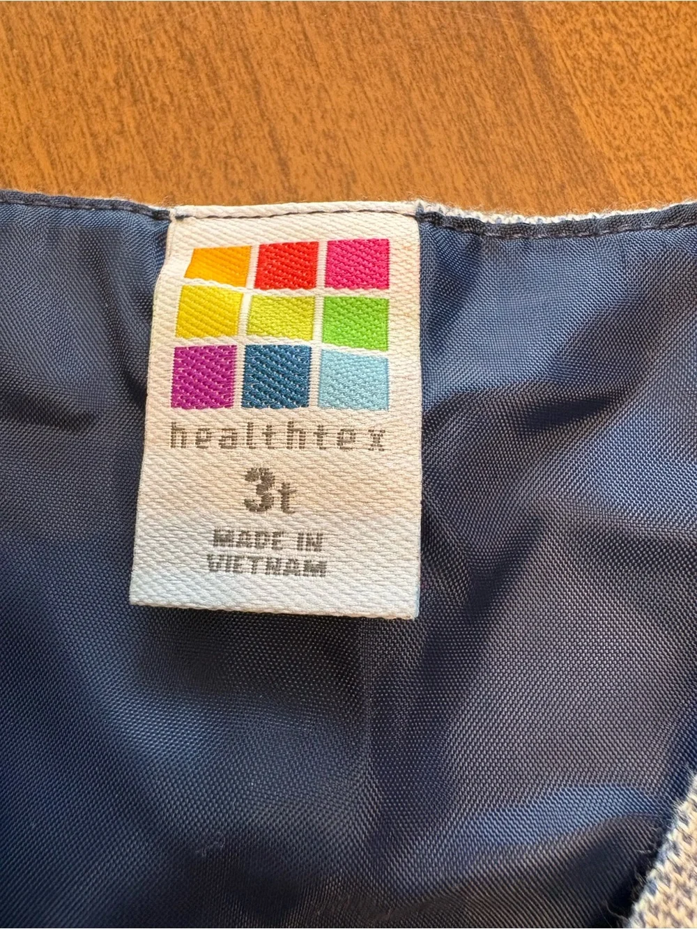 healthtex Navy Blue Garment with Colorful Logo Tag